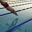 A man dives into a lap pool