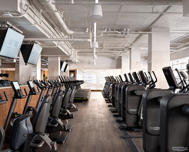 Cardio equipment on the fitness floor at Life Time