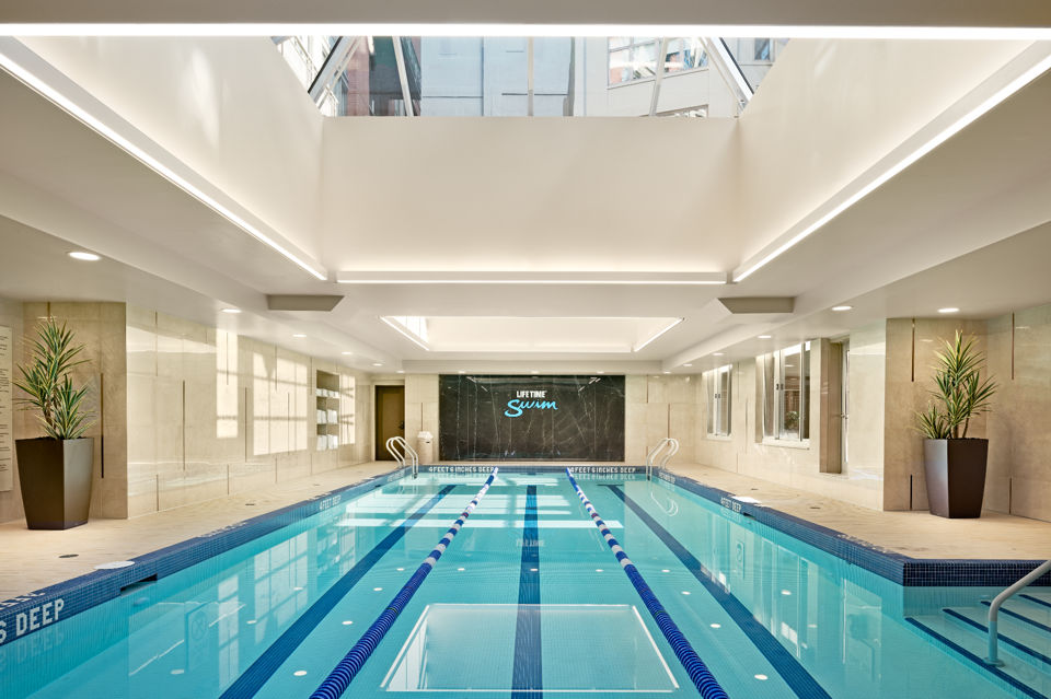3 lane indoor lap pool at Life Time with overhead sky light