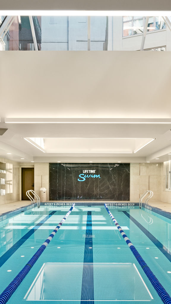 3 lane indoor lap pool at Life Time with overhead sky light