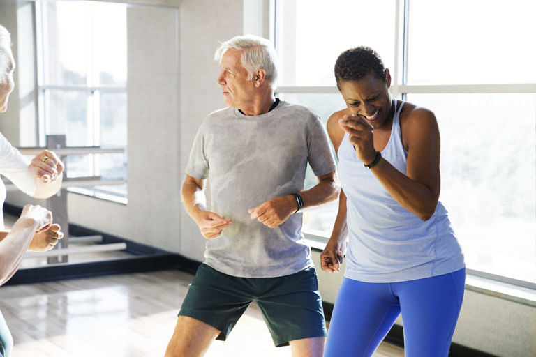 Active-agers participating in a group fitness class.