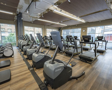 Cardio equipment on the fitness floor at Life Time