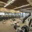 Free weights and strength training machines on the fitness floor at Life Time