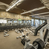 Free weights and strength training machines on the fitness floor at Life Time