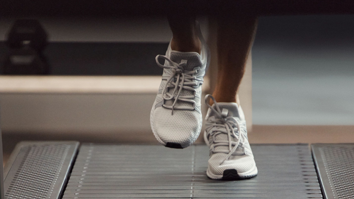 Stylized image of a GTX class member's feet on a treadmill