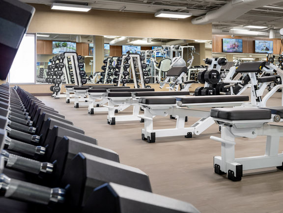 Fitness floor showing weight benches.