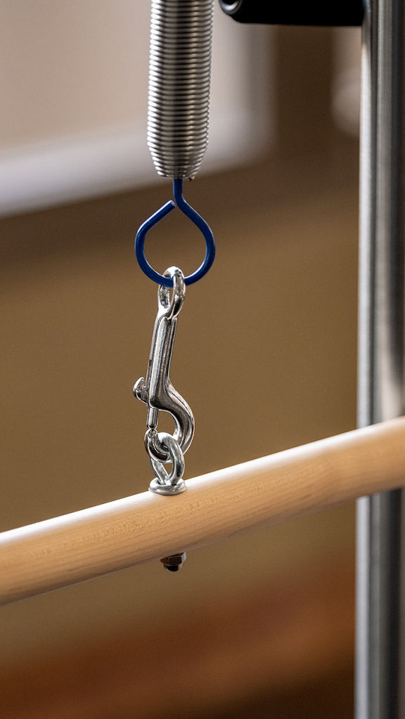 Close-up of a Pilates reformer machine.