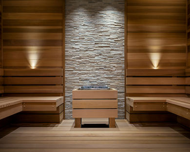 A warm wood and stone sauna interior