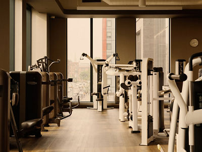 a line of wieght machines on a workout floor