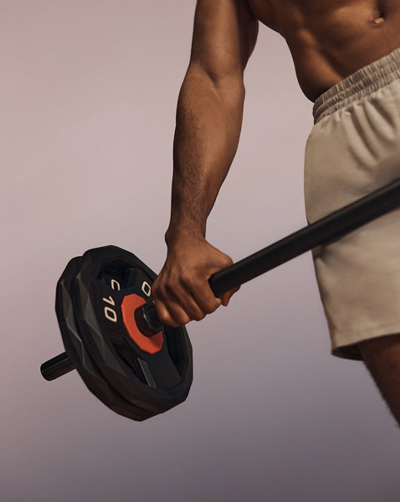 Stylized image of a shirtless Life Time member holding a barbell in a Lift strength class