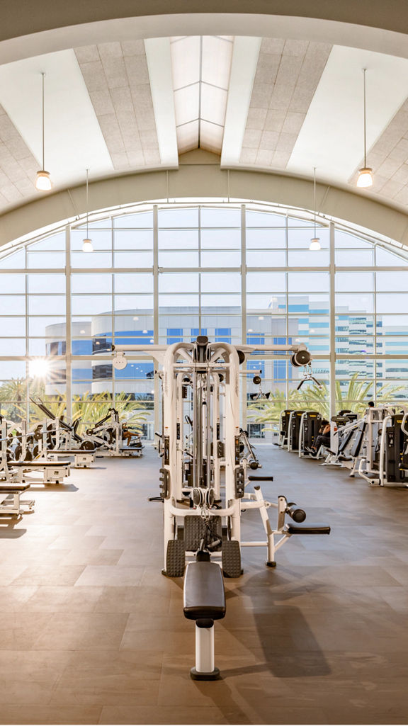 Brightly lit fitness floor at Life Time