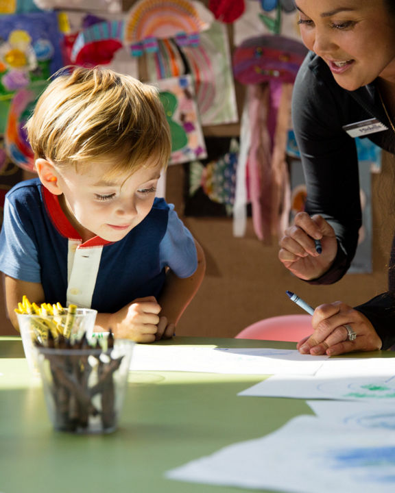 Children coloring during a kids art class at Life Time