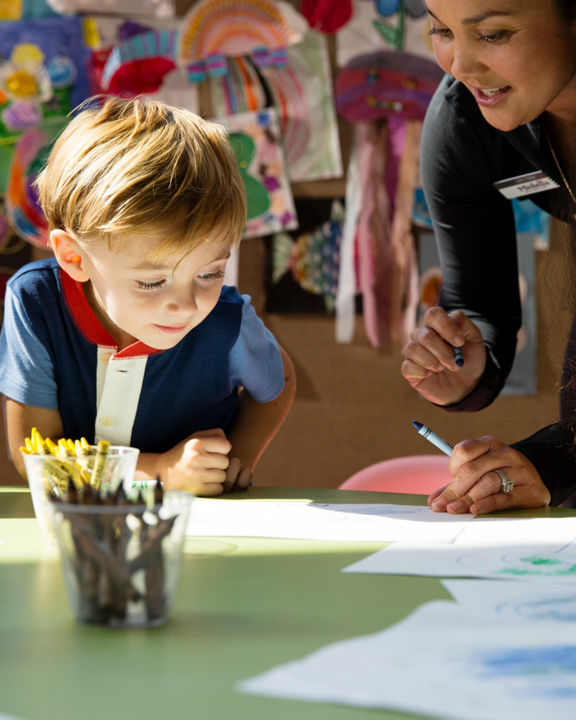 Children coloring during a kids art class at Life Time