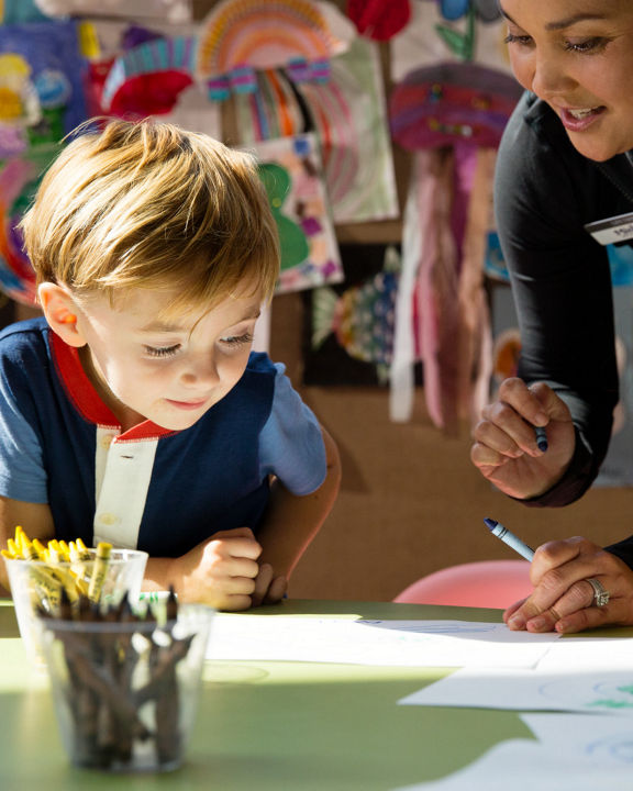 Children coloring during a kids art class at Life Time