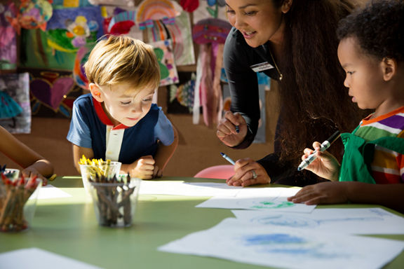 Children coloring during a kids art class at Life Time