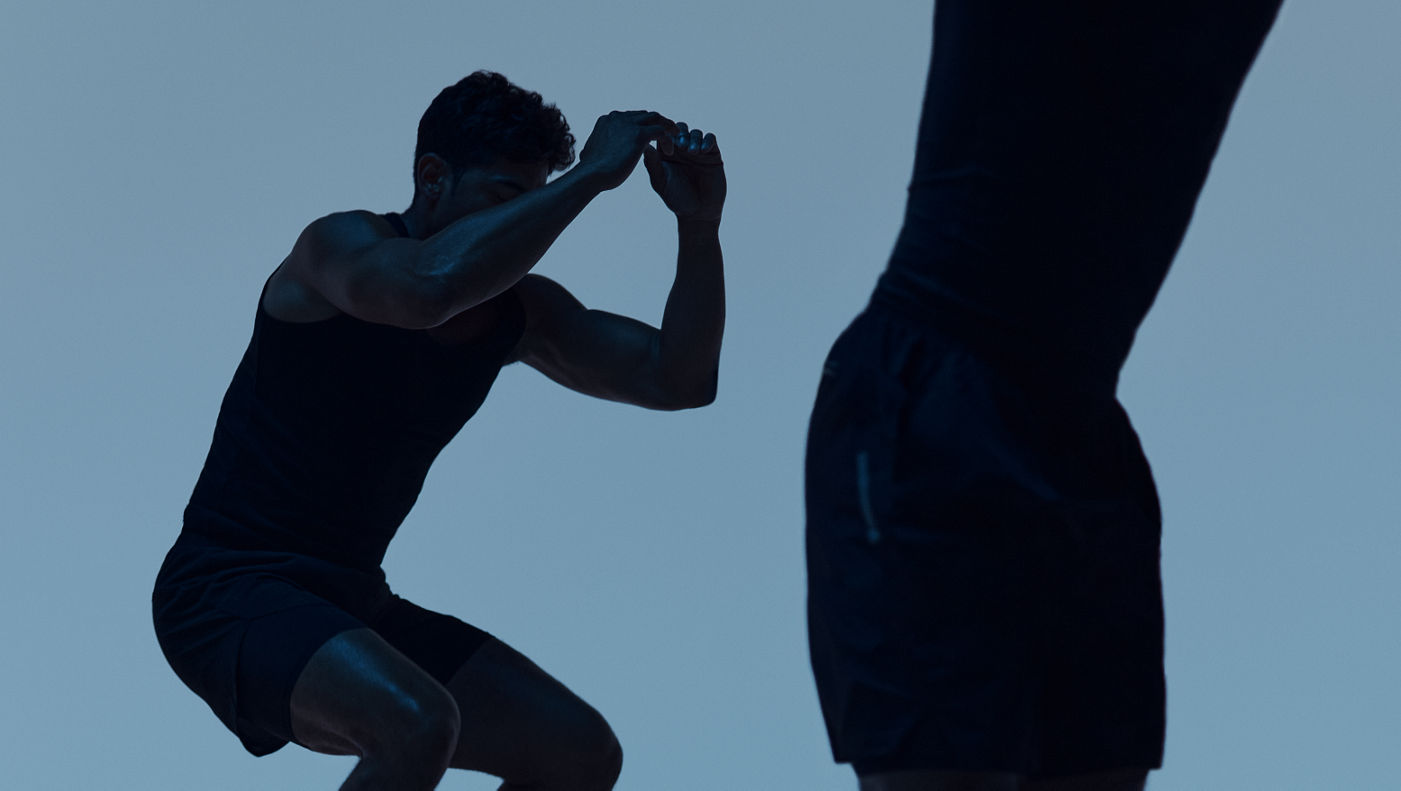 Maxout strength class featuring the silhouette of two people jumping