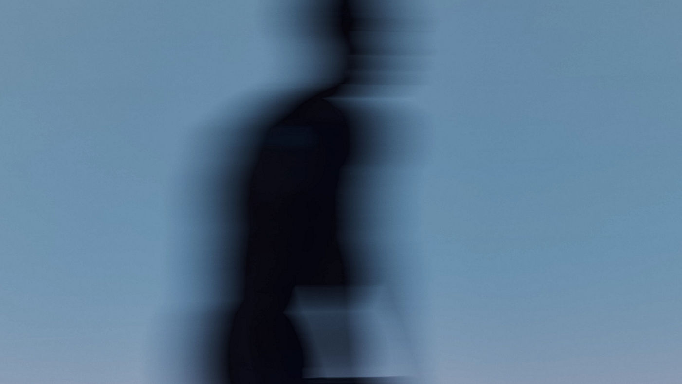 Stylized blurred image of a person moving in a maxout strength class at Life Time