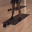 The feet of four Life Time members on their mats at a MB360 boutique group training class