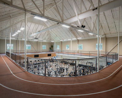Indoor running track above the fitness floor at Life Time