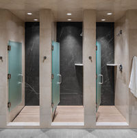 Open shower stalls at Life Time