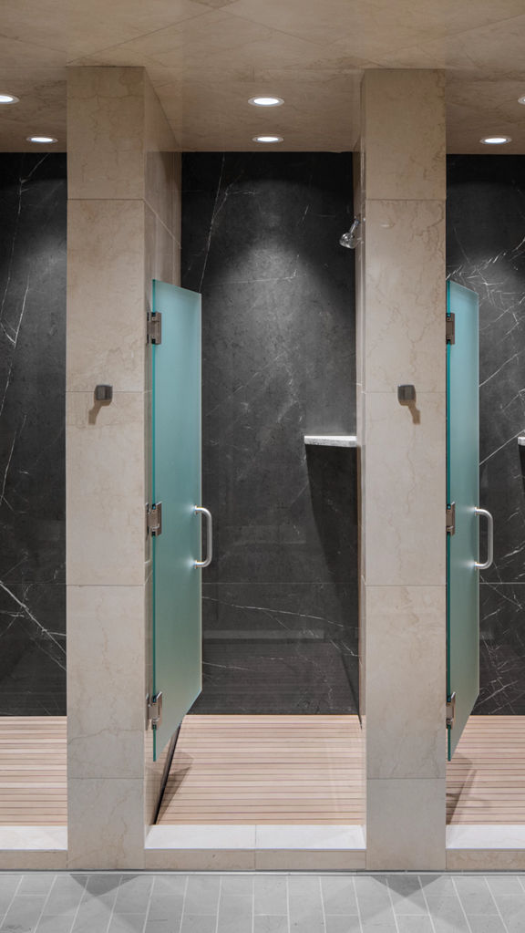 Open shower stalls at Life Time