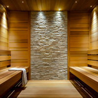 Brightly lit wooden and tiled sauna at Life Time