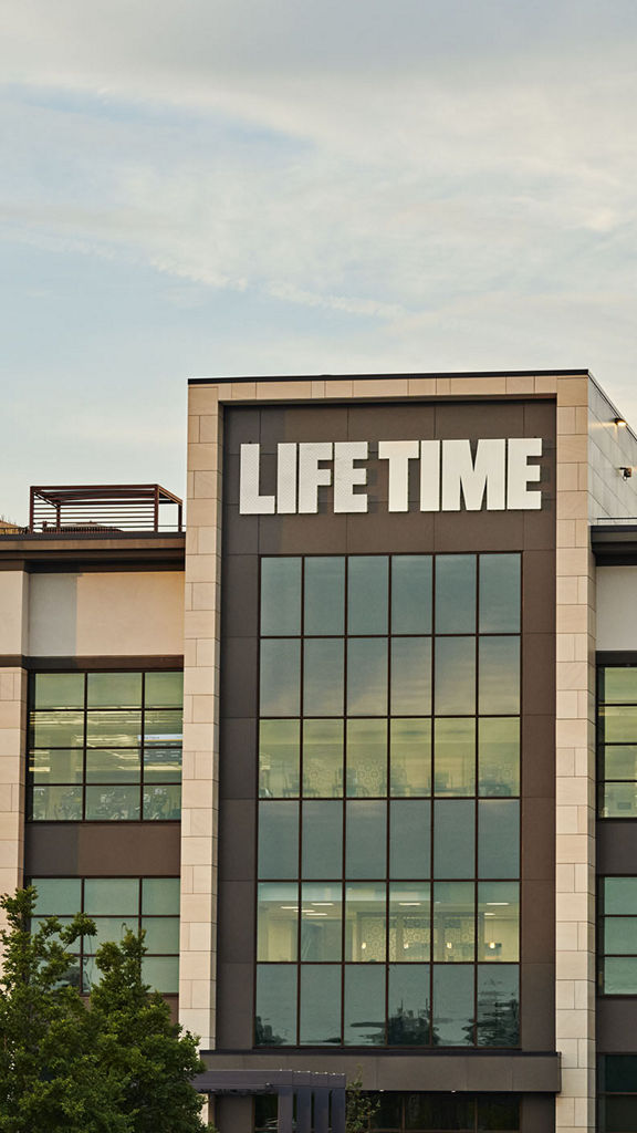 The exterior and front enterance of a Life Time location