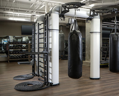 Outrace machine with hanging boxing bags