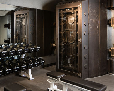 A large steel mechanical safe on the fitness floor at One Wall Life Time club location