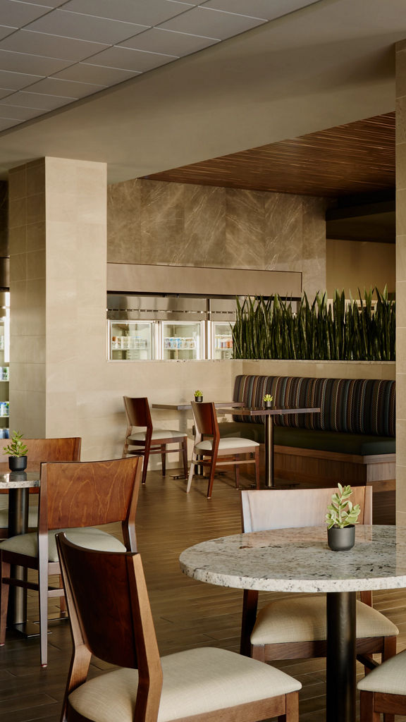 Chairs, tables, and a counter for ordering at a Life Cafe