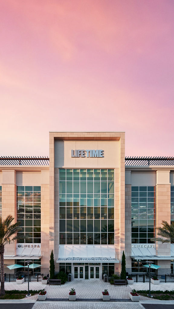 The exterior and front enterance of a Life Time location