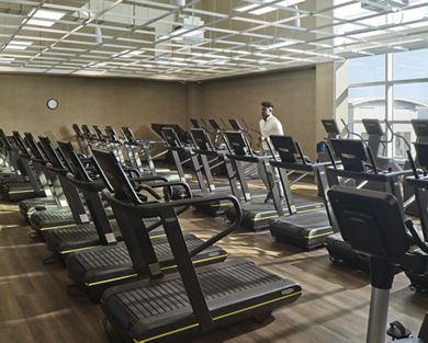 An adult male running on a treadmill