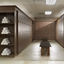 Wooden locker room bay with marble benches and rolled up towels