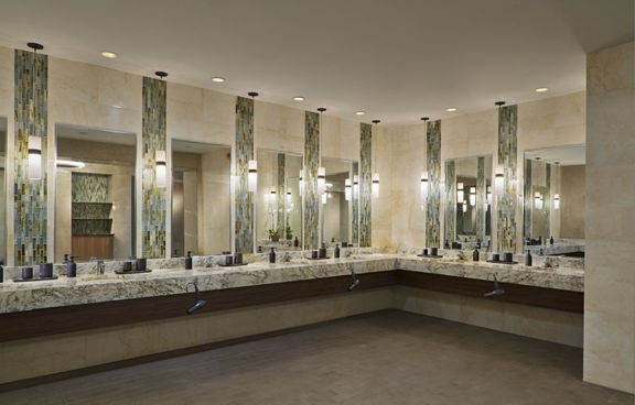 marble tile and glass sink area, with large mirrors