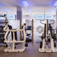 Strength training equipment on the fitness floor at Life Time