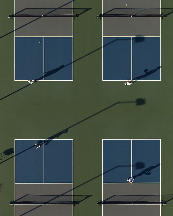 An aerial view of Life Time members playing on four pickleball courts