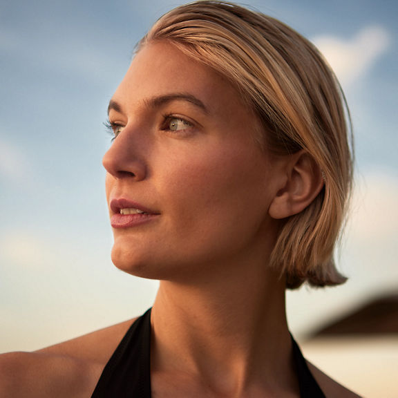 Closeup of a woman's face looking off into the distance