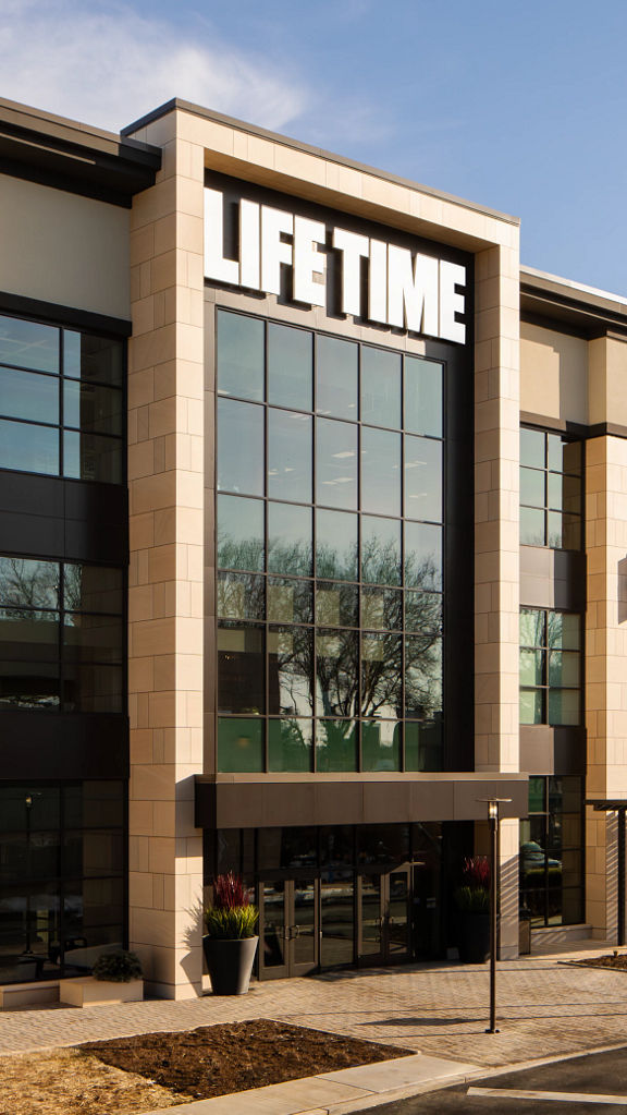 The exterior and front enterance of a Life Time location