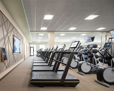 View of treadmills and stairclimbers lined up on the fitness floor in the Rancho SanClemente Life Time location.