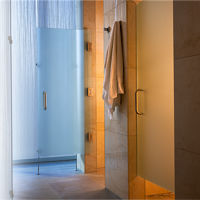 Glass and Tile shower stalls and hanging towel