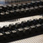 Close-up of a rack filled with dumbbells