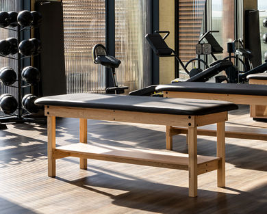 Stretch tables on the fitness floor at Life Time