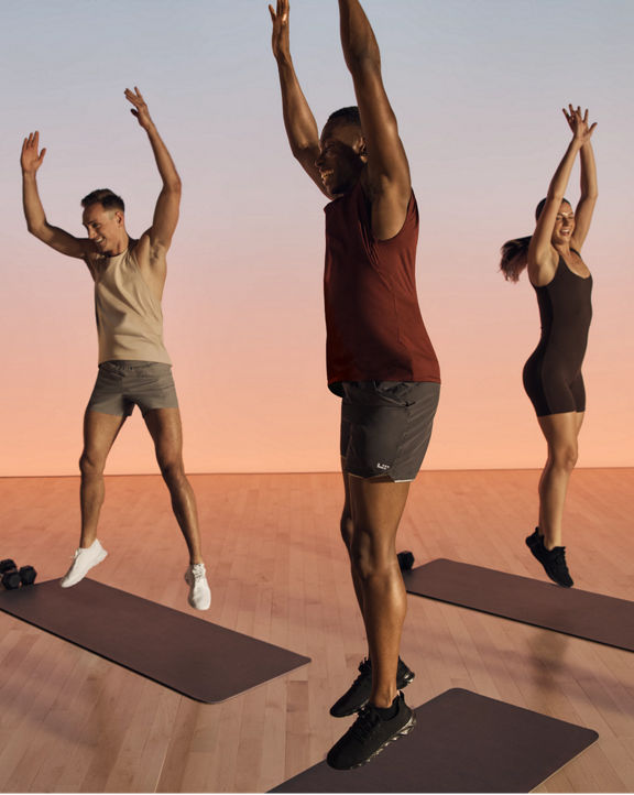 Shred strength members jumping during class