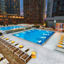 The rooftop pool deck at Life Time Sky at dusk