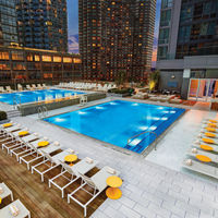The rooftop pool deck at Life Time Sky at dusk