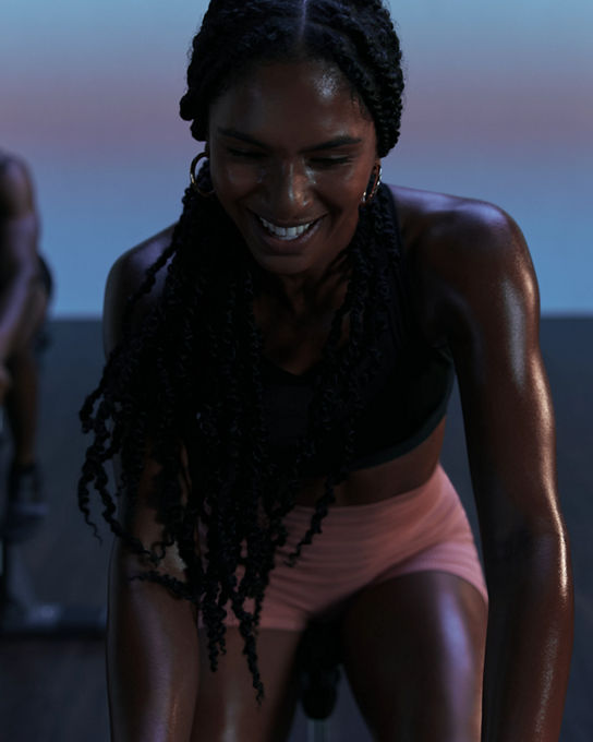 Front view of cyclist in AMP spin class at Life Time