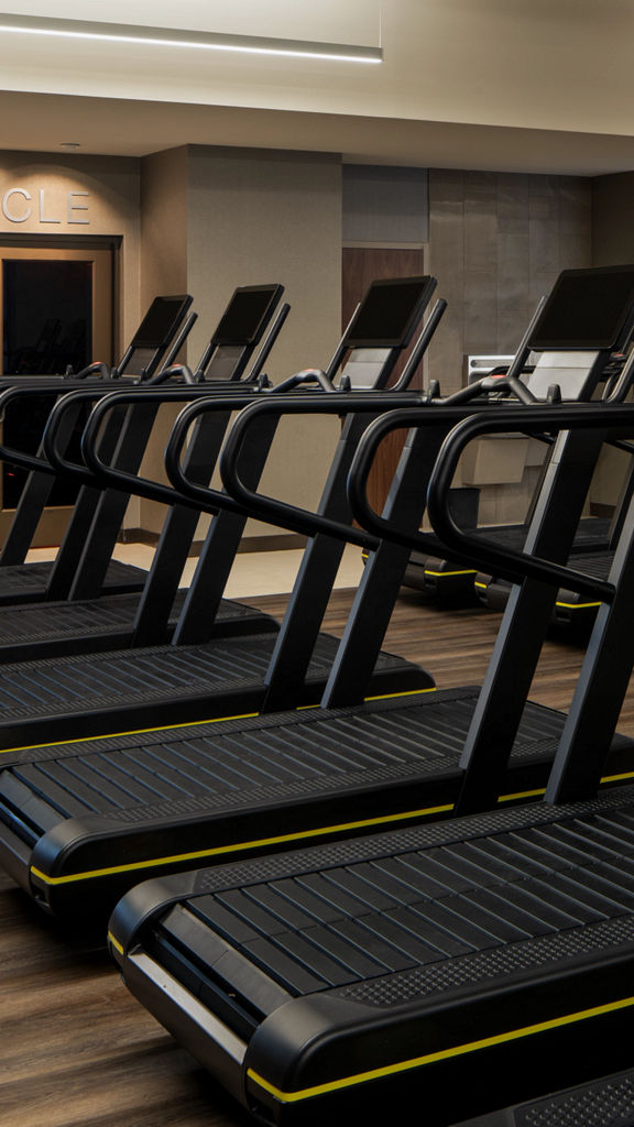 Treadmills on a fitness floor at a Life Time location