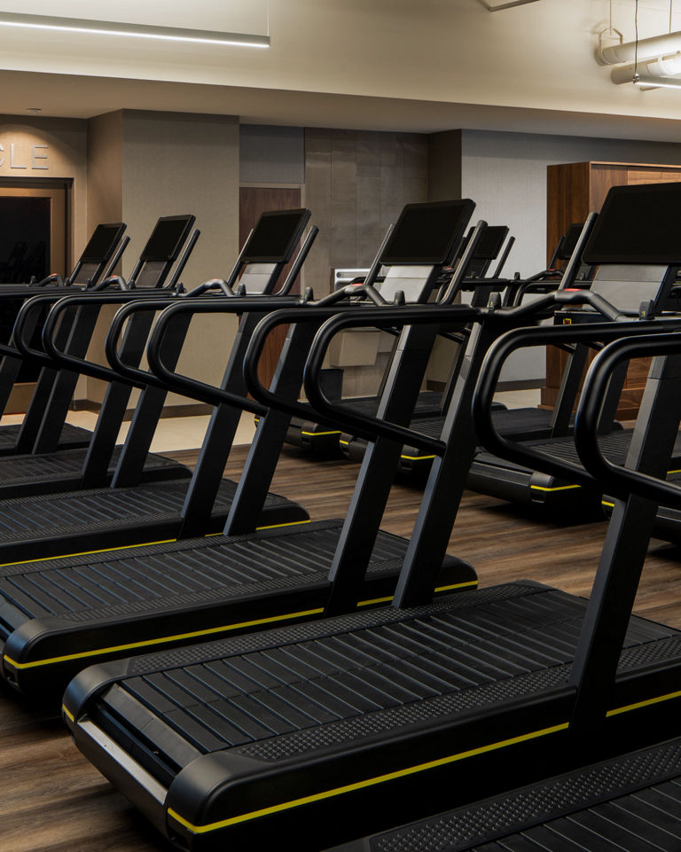 Treadmills on a fitness floor at a Life Time location