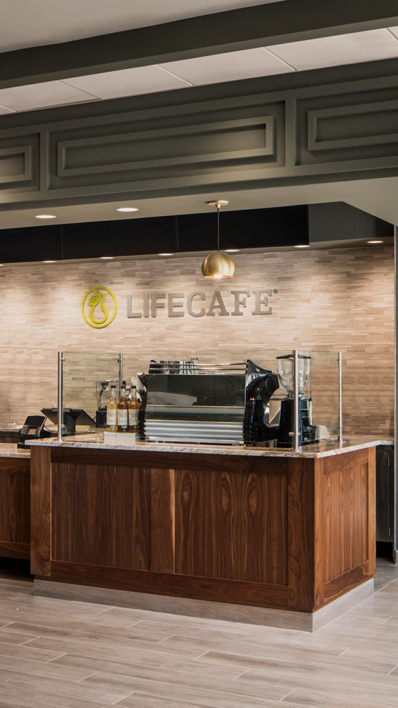 The LifeCafe counter and seating at a Life Time club location