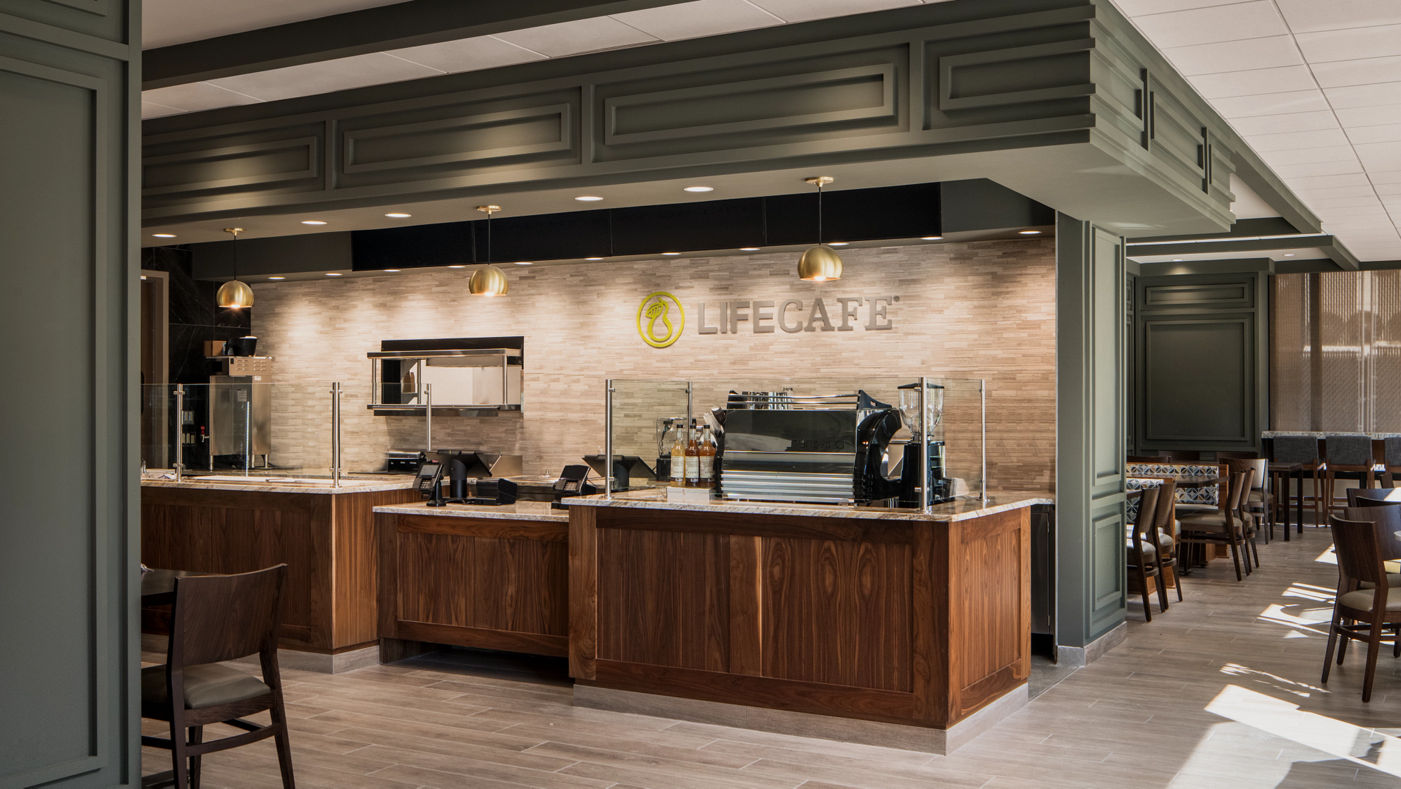 The LifeCafe counter and seating at a Life Time club location
